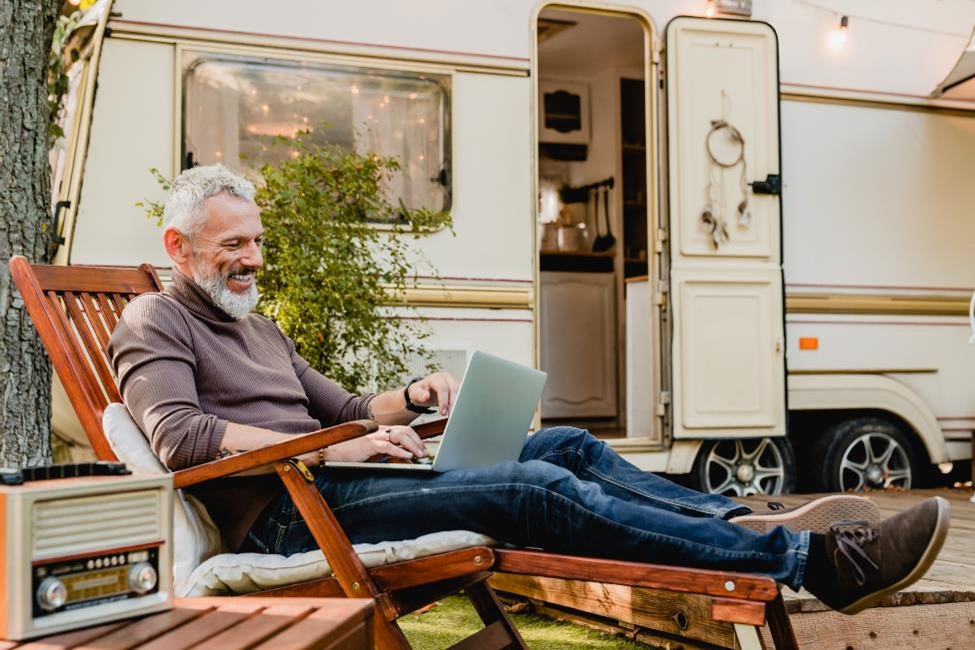 A man next to his RV